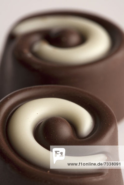 Close-up of two chocolates