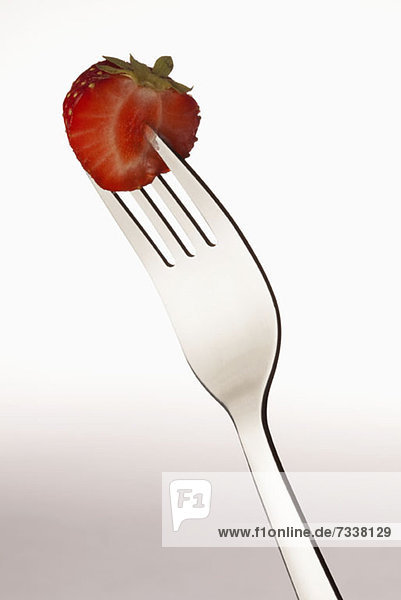 Half a strawberry on a fork