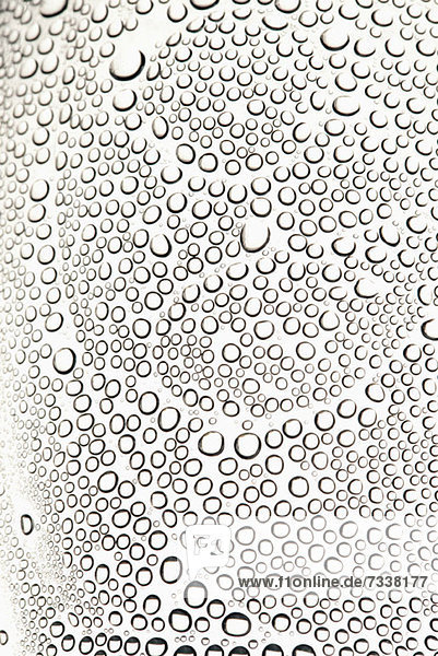 Condensation on a shiny surface making an abstract pattern