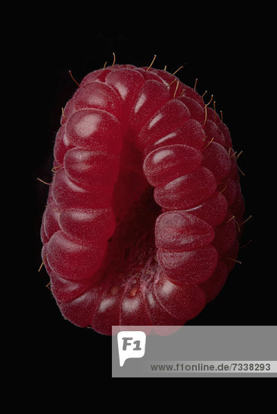 A raspberry arranged suggestively