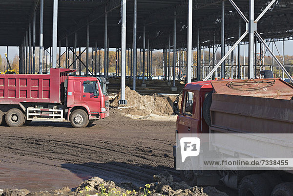 Parked dumper trucks at construction site