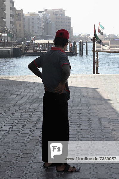 Man on pier at Dubai Creek  Dubai  United Arab Emirates