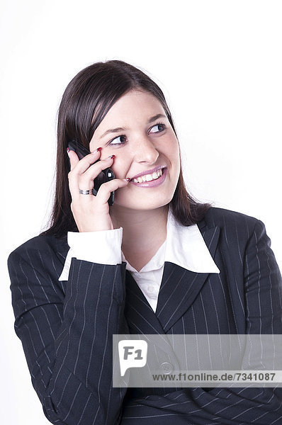 Geschäftsfrau beim Telefonieren  freudig