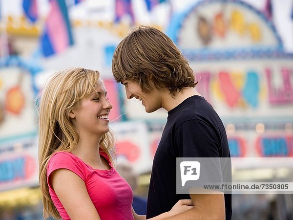 young couple at an amusement park