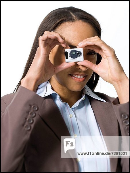 Portrait of a businesswoman using a digital camera