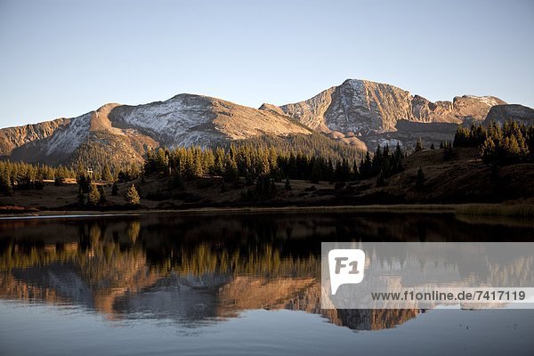 The Rocky Mountains are reflected in Molas Lake near Silverton  CO.