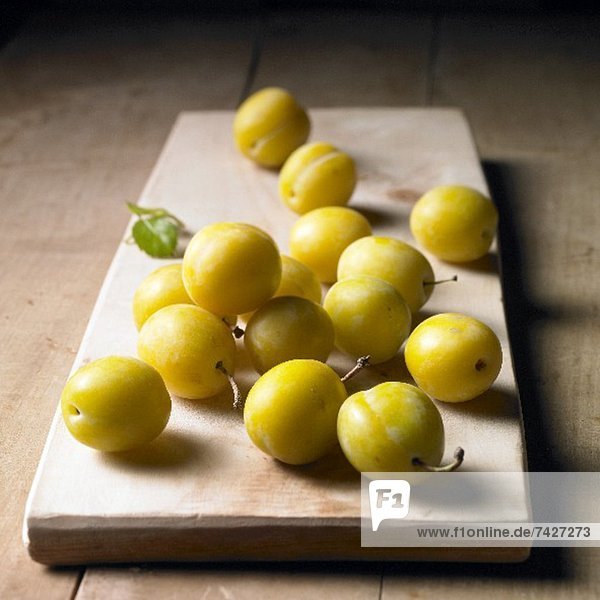 Mirabelles on a wooden board