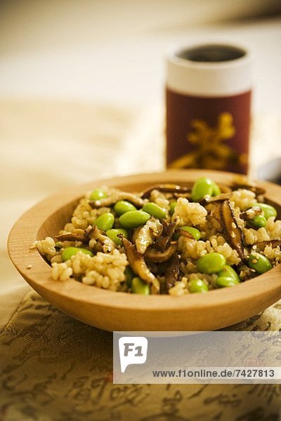 Bowl of Brown Rice with Edamame and Sliced Mushrooms