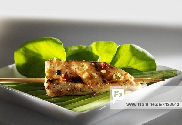 A sate kebab with lemongrass and peppercorns