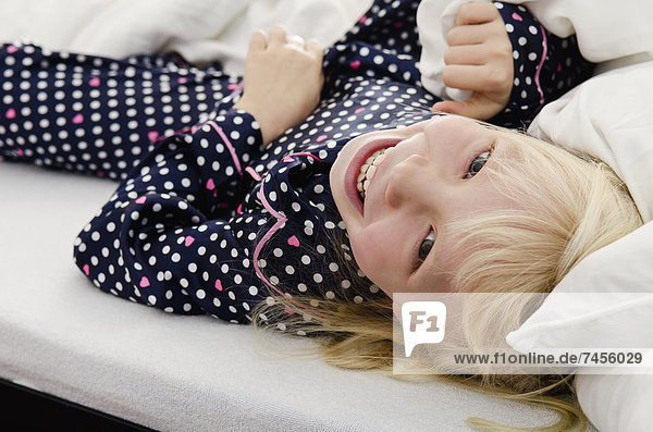 Girl lying in bed