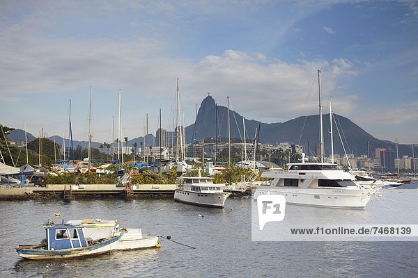 Boats in Guanabara Bay with Christ the Redeemer statue (Cristo Redentor) in the background  Urca  Rio de Janeiro  Brazil  South America