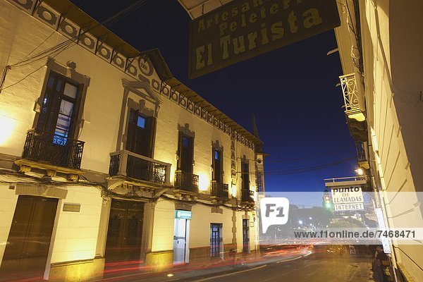 Traffic passing along street at dusk  Sucre  UNESCO World Heritage Site  Bolivia  South America