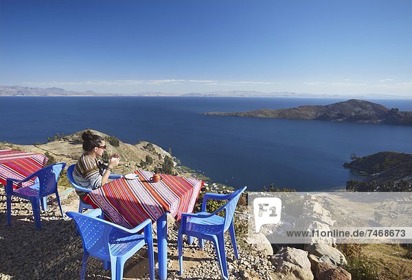 Woman at outdoor cafe on Isla del Sol (Island of the Sun)  Lake Titicaca  Bolivia  South America