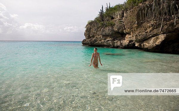 Woman walking in tropical water