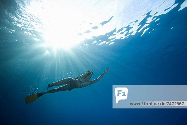 Woman snorkeling underwater