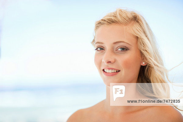 Smiling woman standing outdoors