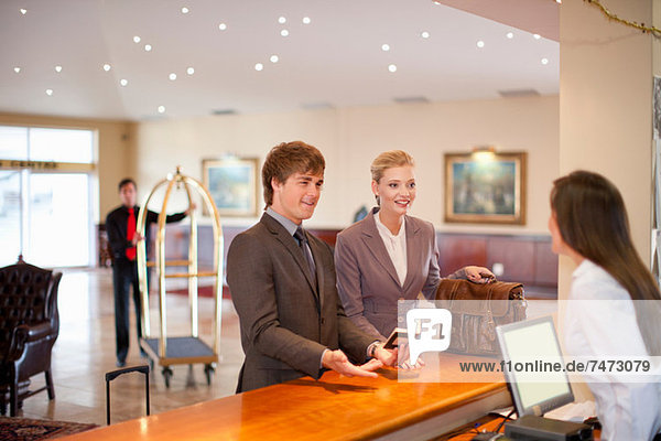 Businesswoman checking in to hotel