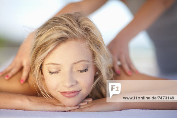 Smiling woman having massage