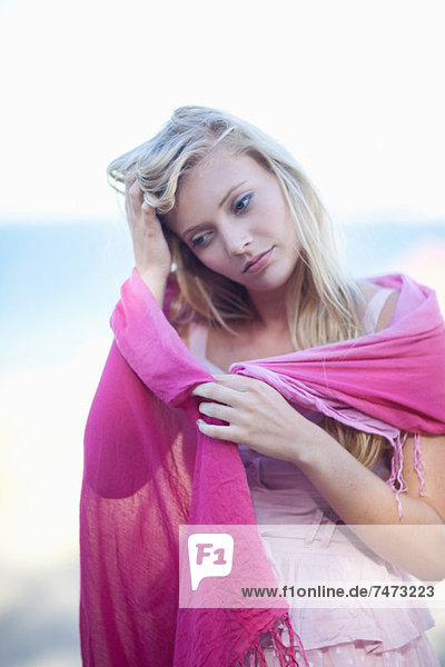 Woman wrapped in scarf outdoors
