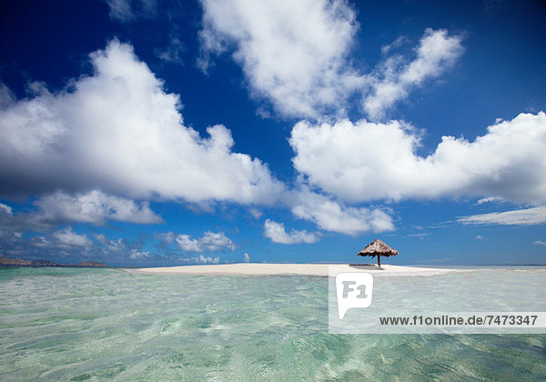 Clouds over sandbar and tropical water