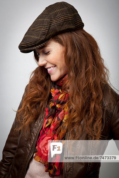 Smiling woman wearing hat and jacket