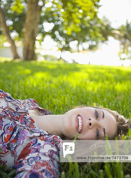 Woman Lying on Grass  Miami Beach  Florida  USA