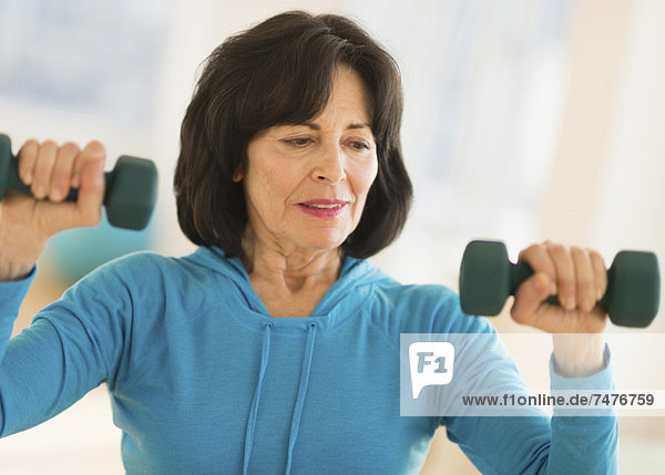 Portrait of senior woman exercising