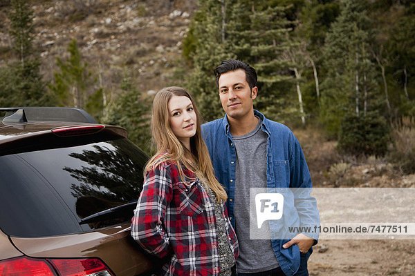 Portrait of young couple during road trip