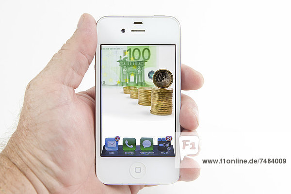 Euro coins and euro banknotes on the display of a smartphone  symbolic image for mobile phone costs