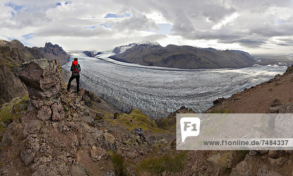 Mountaineer in front of Vatnajoekull glacier tongue  Skaftafell  South Iceland  Iceland  Europe