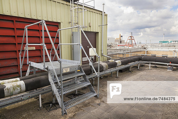 Steps giving access over roof top industrial plant pipework  Southampton  Hampshire  England  United Kingdom  Europe