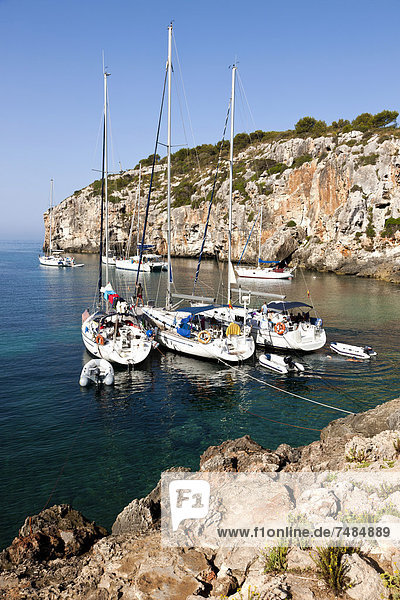 Yachts moored in the bay of Cales Coves  South Menorca  Menorca Island  Balearic Islands  Spain  Southern Europe
