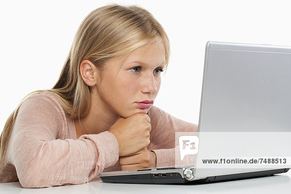 Teenage girl using laptop  close up