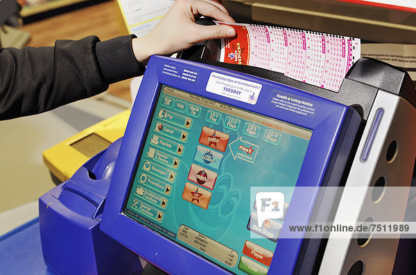 Camelot National Lottery Terminal in a shop  United Kingdom  Europe