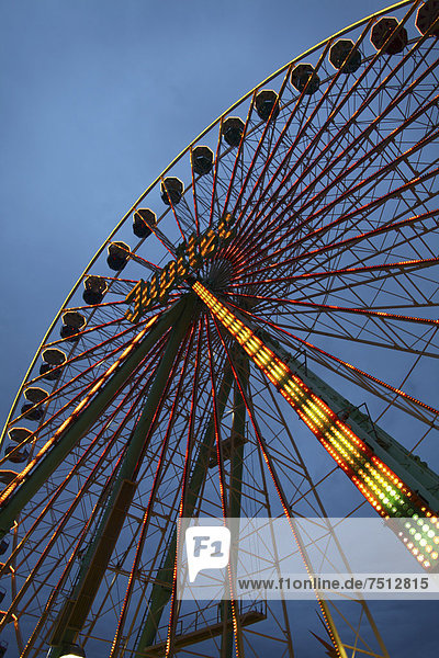 Ferris wheel at dusk  fairground  children and folk festival  Laupheim  Baden-Wuerttemberg  Germany  Europe