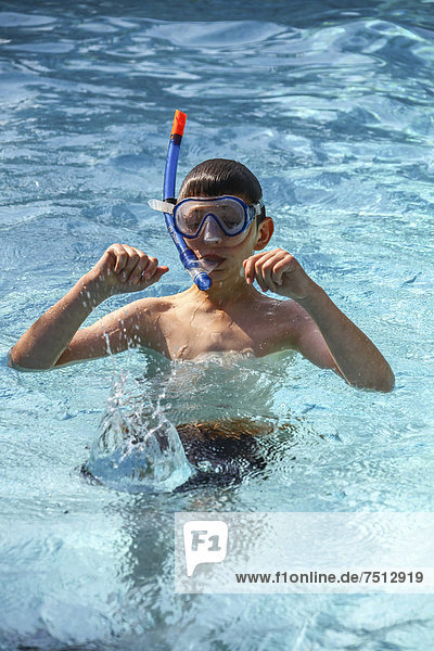 Boy  12 years  with diving goggles in a pool  Cote d'Azur  France  Europe