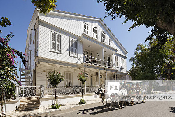Horse-drawn carriage in front of a wooden mansion  Büyükada  Princes Islands  Adalar  Marmara Region  Istanbul  Turkey  Asia