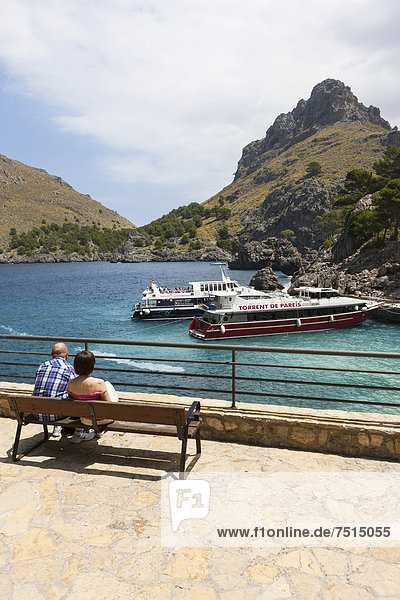 Tourists watching the ferries in the Bay of Sa Calobra  Tramuntana Mountains  Majorca  Balearic Islands  Mediterranean Sea  Spain  Europe