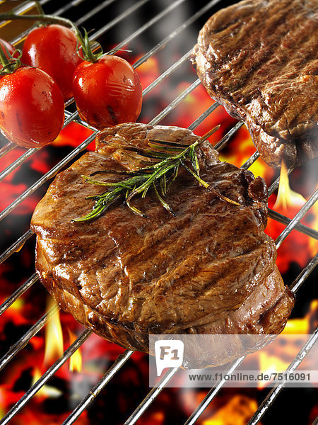 Barbecue fillet steak cooking on a BBQ grill