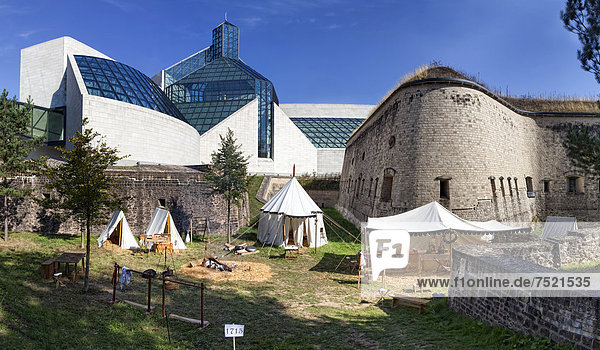 Camp at a live role play or ReenLarpment  a historical reconstruction of a reenactment group  in front of the MusÈe d'Art Moderne Grand-Duc Jean  Mudam  and the Fort Thuengen or Dräi Eechelen  European quarter  Kirchberg-Plateau  Luxembourg City  Europe  PublicGround