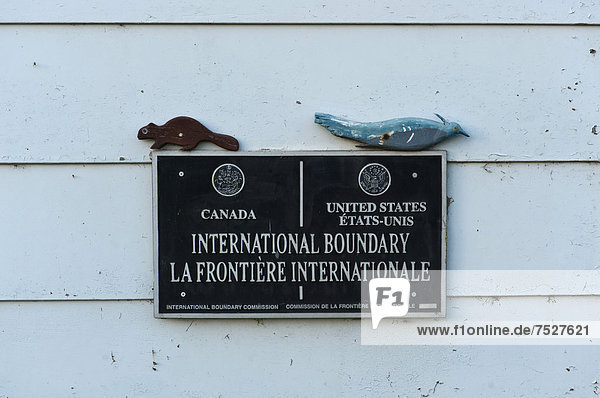 Sign at the border between Canada and the United States of America  Quebec  Fort Kent  Maine  North America