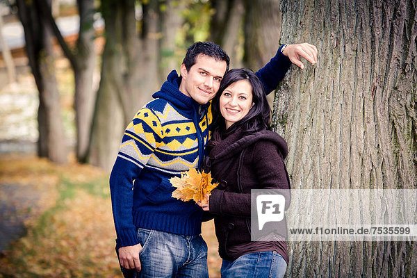 Young couple in a park in autumn