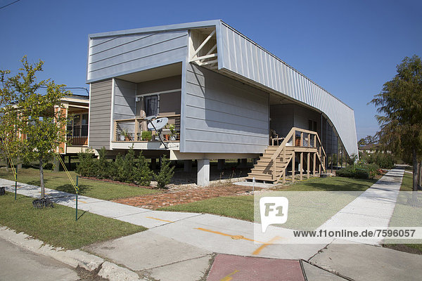 New homes built by Brad Pitt's Make It Right Foundation  the homes are elevated to protect against future flooding and built according to green design principles  in the lower ninth ward  New Orleans  Louisiana  USA