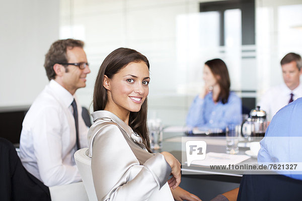 Businesswoman smiling in meeting