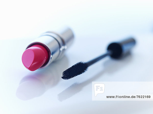Close up of tube of lipstick and mascara