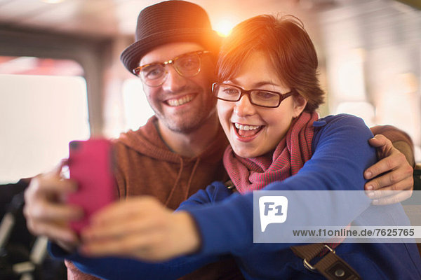 Couple taking picture with cell phone