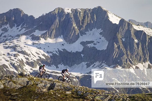 Two mountainbikers in the Alps  Andermatt  Switzerland