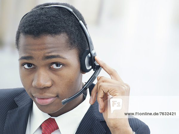 Businessman  wearing a headset in an office