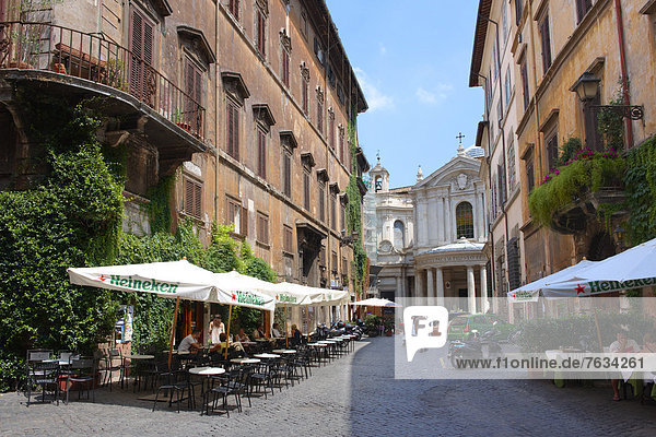 Cobbled street and cafes of the Piazza Navona region of Rome  Italy  Europe