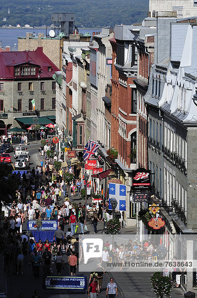 Canada  Old Town  Quebec  Quebec City  Rue St. Jean  above  aerial  busy  street  colorful  from above  men  pedestrians  people  shop  shoppers  shopping  store  vertical  walking  women